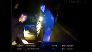 Watch an angry, Aussie cop bash a hoon's head in